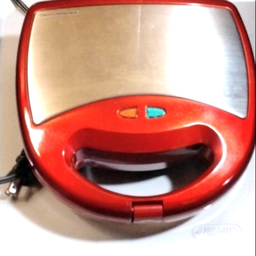 A red  waffle maker